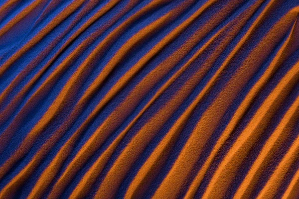 Vista superior de fondo ondulado abstracto con filtro de arena y color - foto de stock