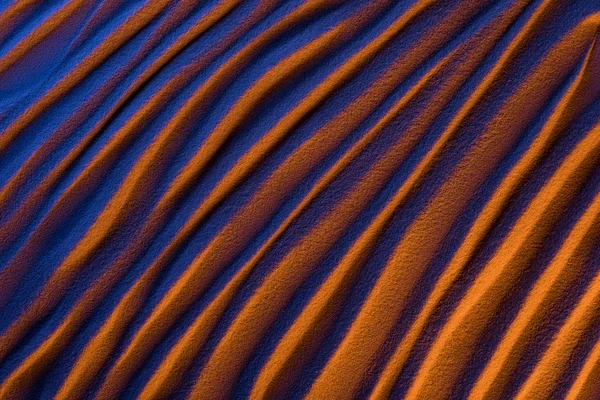 Vista dall'alto di sfondo ondulato astratto con sabbia e filtro colore — Foto stock