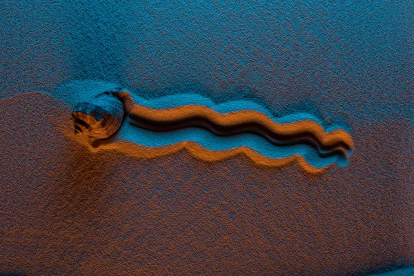 Top view of seashell trace on sand with color filter and copy space — Stock Photo