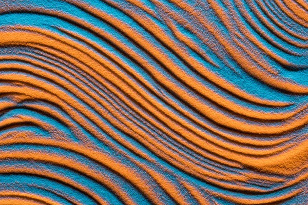 Vue du dessus du fond ondulé abstrait avec sable texturé et filtre de couleur — Photo de stock