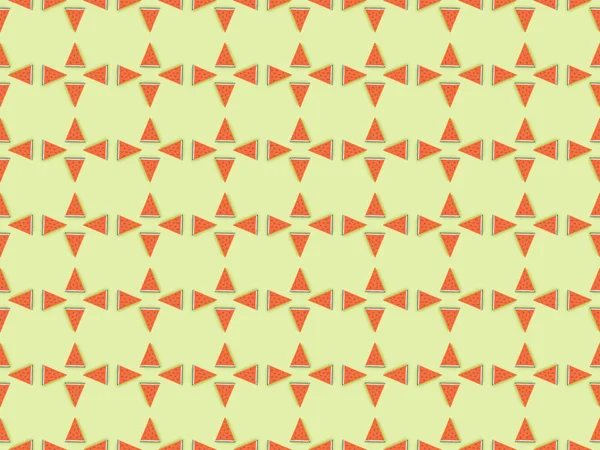 Top view of pattern with handmade paper watermelon slices isolated on green — Stock Photo