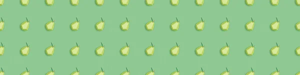 Panoramic shot of seamless pattern with handmade paper pears isolated on green — Stock Photo