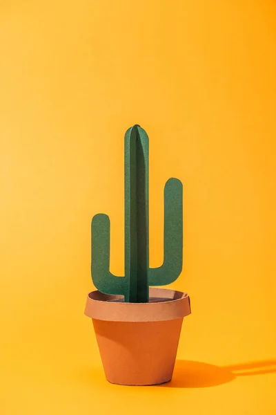 Handmade green paper cactus in flower pot on orange — Stock Photo