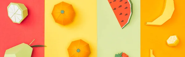 Panoramic shot of various origami fruits on colorful paper stripes — Stock Photo