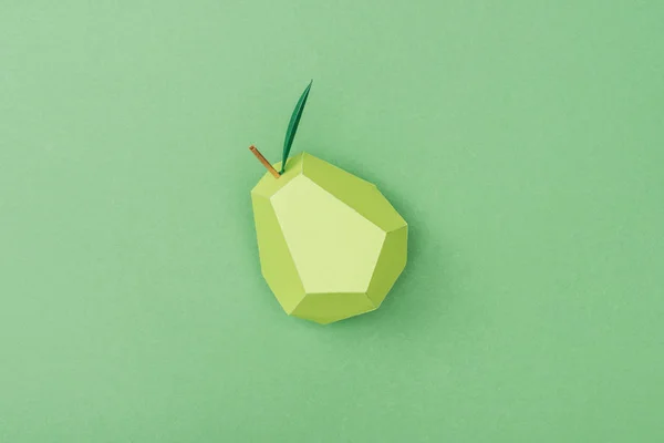 Top view of handmade paper pear isolated on green — Stock Photo