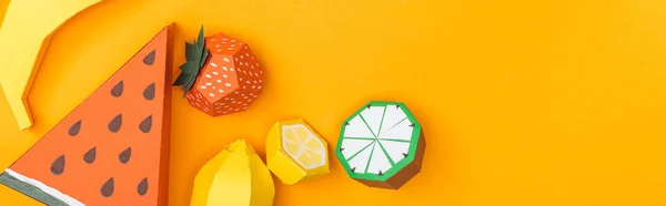 Panoramic shot of multicolored handmade paper fruits isolated on orange with copy space — Stock Photo