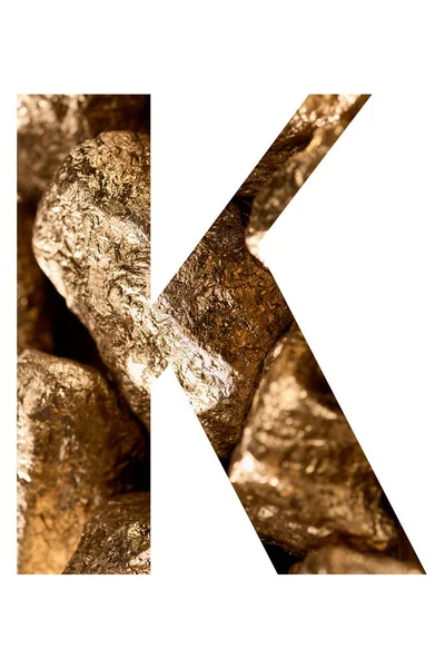 Letter K made of shiny golden stones isolated on white — Stock Photo