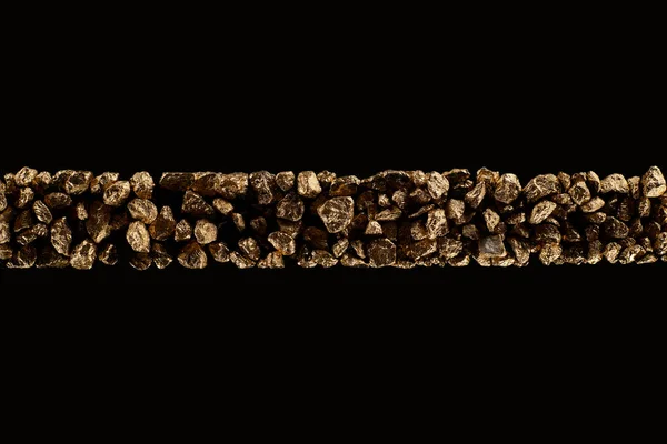 Top view of golden textured stones in horizontal tight row isolated on black — Stock Photo