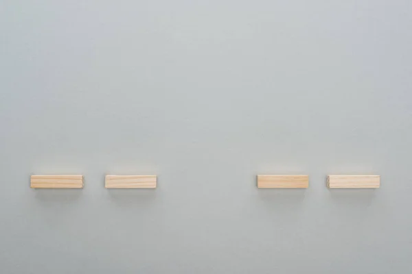 Top view of wooden blocks isolated on grey with copy space — Stock Photo