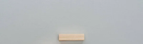 Panoramic shot of wooden block isolated on grey with copy space — Stock Photo