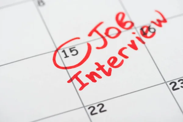 Close up view of print calendar with red mark and job interview lettering — Stock Photo