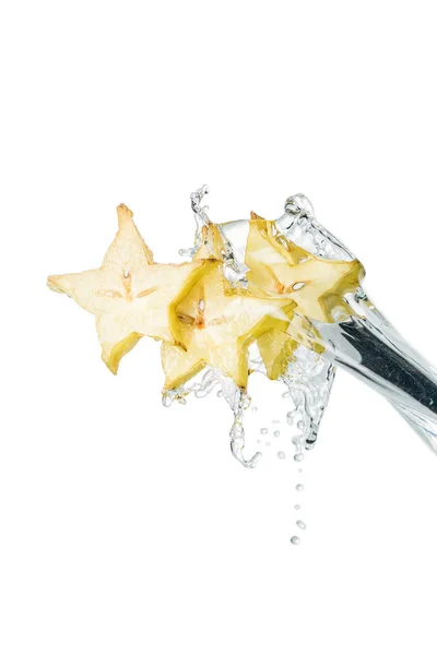 Fresh exotic star fruit slices and water splash isolated on white — Stock Photo