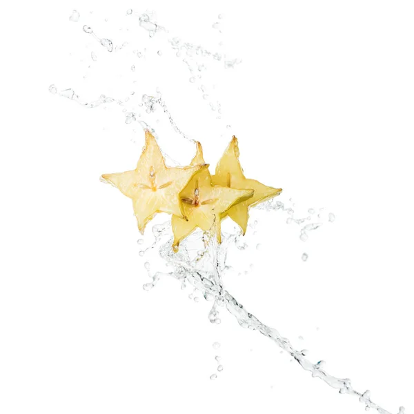 Fresh exotic star fruit slices and water splash with drops isolated on white — Stock Photo