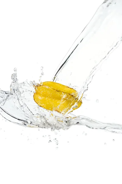 Whole ripe star fruit and water splash with drops isolated on white — Stock Photo