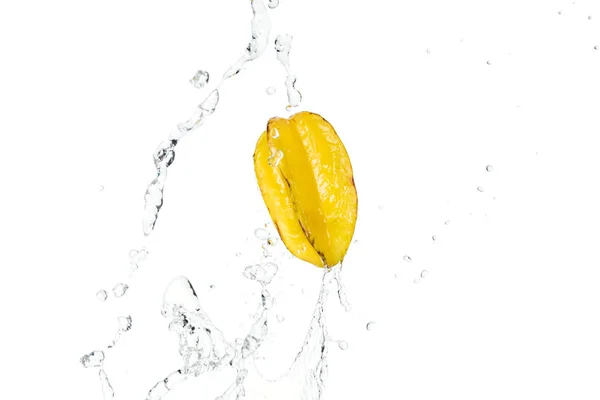 Whole ripe exotic star fruit and water splash with drops isolated on white — Stock Photo