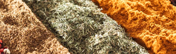 Close up view of various aromatic traditional indian spices, panoramic shot — Stock Photo