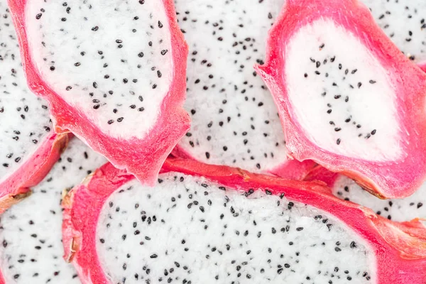 Top view of exotic ripe dragon fruit slices — Stock Photo