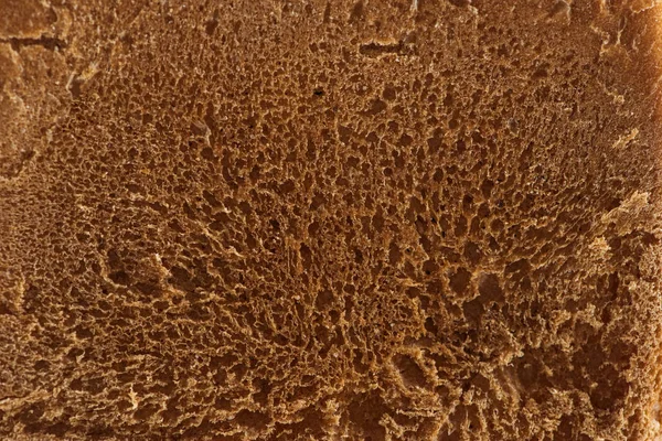 Close up view of brown fresh baked textured bread — Stock Photo