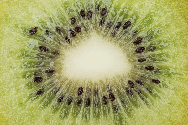 Close up view of fresh nutritious green kiwi with black seeds — Stock Photo