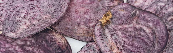 Panoramic shot of fresh purple radish slices in pile — Stock Photo