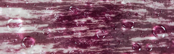 Panoramic shot of fresh red cabbage textured leaf with water drops — Stock Photo