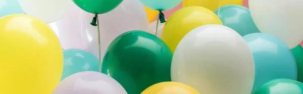 Close up view of multicolored party decorative balloons, panoramic shot — Stock Photo