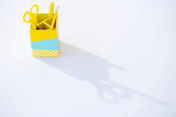 Pencil box with scissors, pen and pencil on white background — Stock Photo