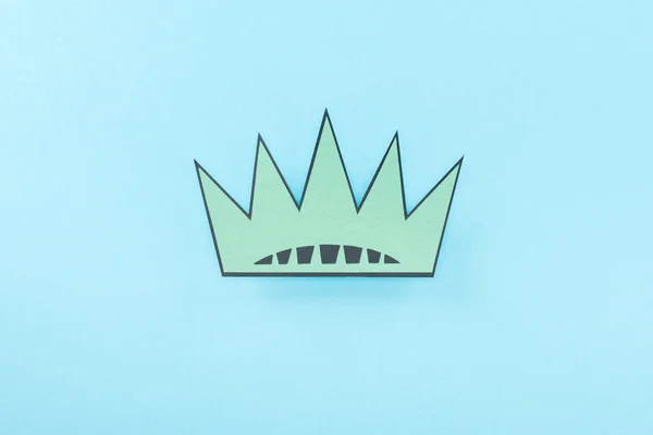 Top view of paper cut crown on blue background, Independence Day concept — Stock Photo
