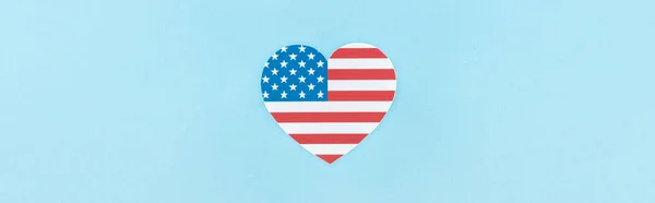 Top view of paper cut decorative heart made of american flag on blue background, panoramic shot — Stock Photo