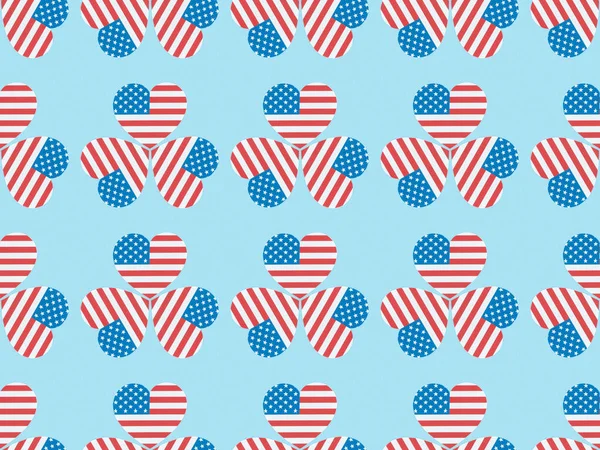 Seamless background pattern with hearts made of usa flags on blue — Stock Photo