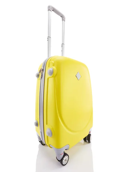 Yellow wheeled colorful suitcase with handle isolated on white — Stock Photo