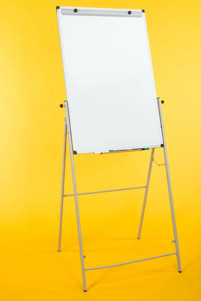 White flipchart with copy space isolated on yellow — Stock Photo