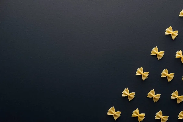 Top view of farfalle pasta isolated on black — Stock Photo