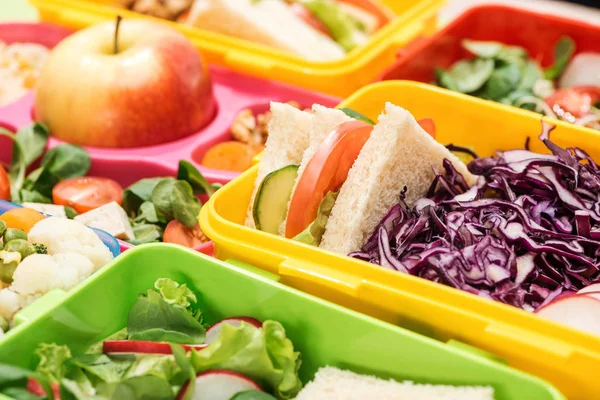 Close up view of tasty food in lunch boxes — Stock Photo