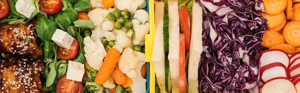 Panoramic shot of lunch boxes with food — Stock Photo