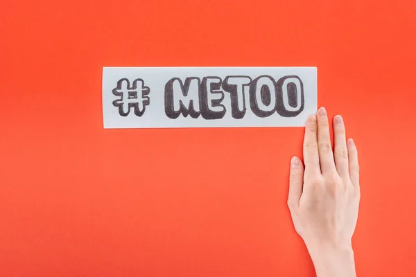 Cropped view of woman holding paper with hashtag me too isolated on orange — Stock Photo