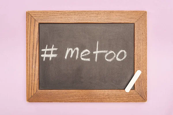 Top view of chalk on chalkboard with written hashtag me too isolated on pink — Stock Photo