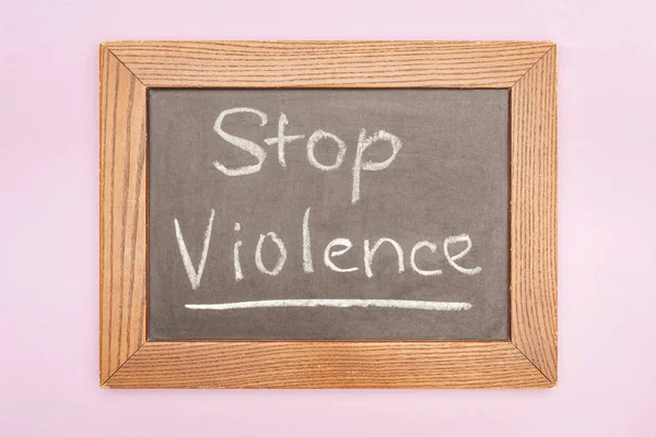 Top view of inscription on blackboard isolated on pink — Stock Photo