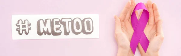Panoramic shot of purple awareness ribbon on hands of woman near paper with hashtag me too isolated on pink — Stock Photo