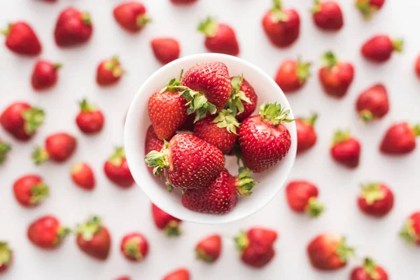 Top view of sweet  and red strawberries on white bowl — Stock Photo