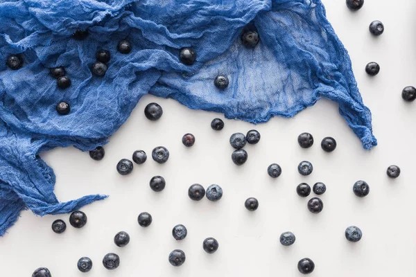 Top view of sweet and whole blueberries on blue cloth — Stock Photo