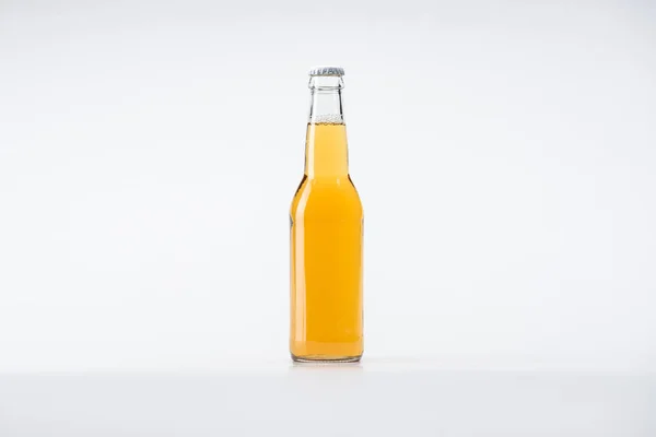 Glass bottle of beer on white background with copy space — Stock Photo