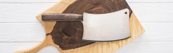 Panoramic shot of wooden chopping board and meat chopper — Stock Photo