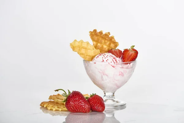 Delicious ice cream with waffles and strawberries in bowl isolated on white — Stock Photo