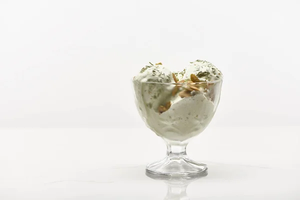 Delicious pistachio ice cream with nuts isolated on white — Stock Photo