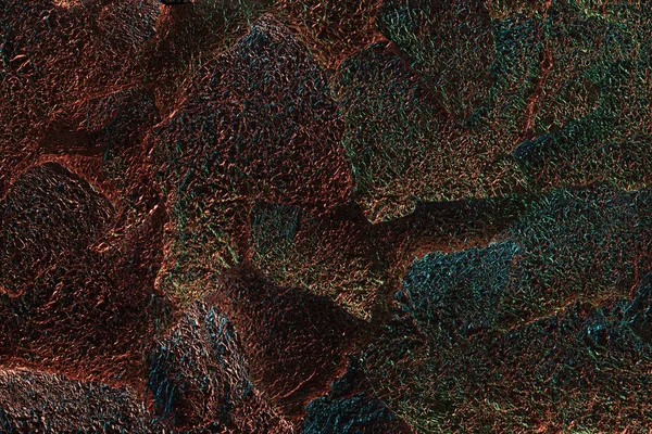 Абстрактний фон з текстурованої горіхової фольги з барвистим освітленням — стокове фото