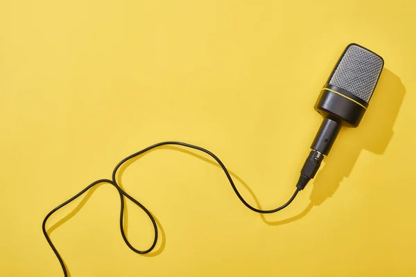 Top view of microphone on bright and colorful background — Stock Photo