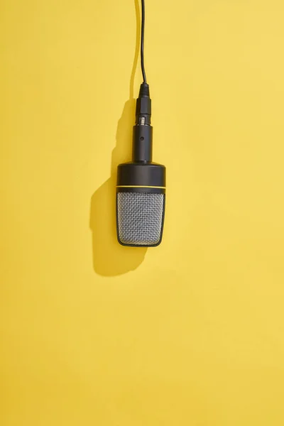 Top view of microphone on bright and colorful background — Stock Photo