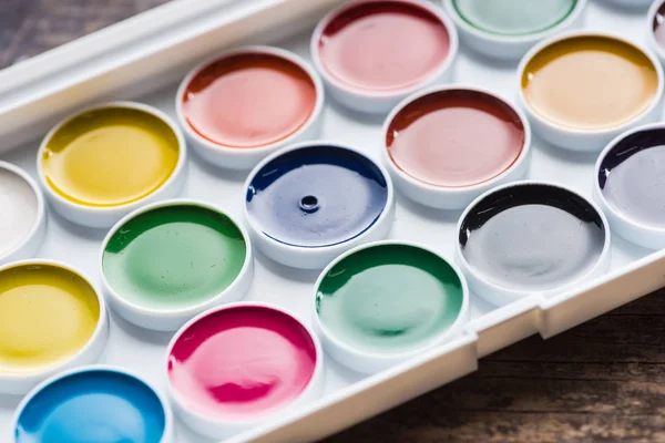 Close up view of watercolor new paint palette — Stock Photo