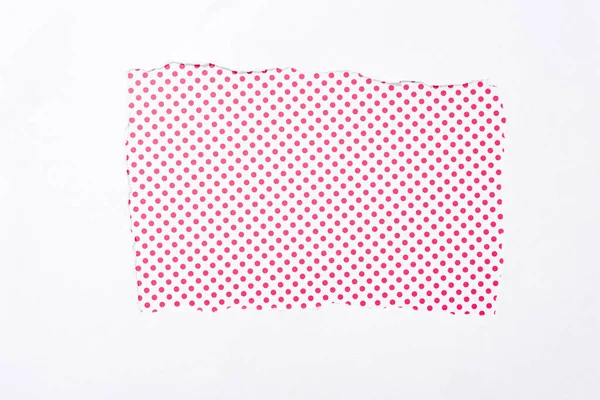 Polka dot pink and white colorful background in white torn paper hole — Stock Photo